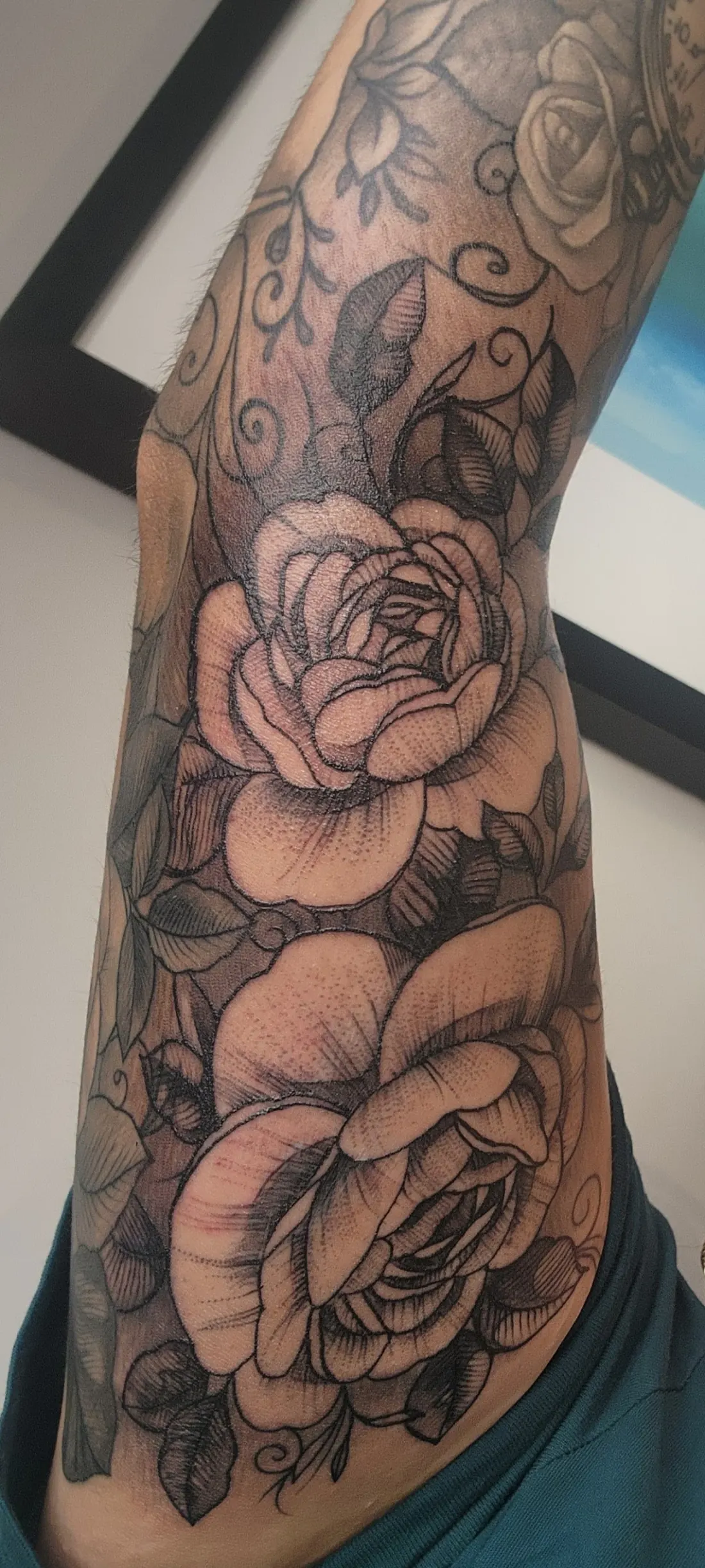 Black and grey realism rose tattoo sleeve